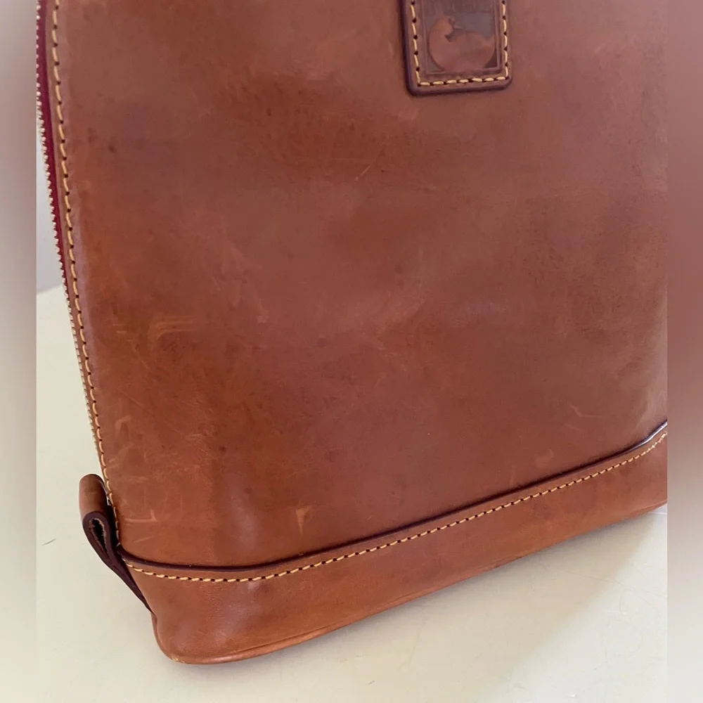 Dooney and Bourke Florentine leather small backpack.